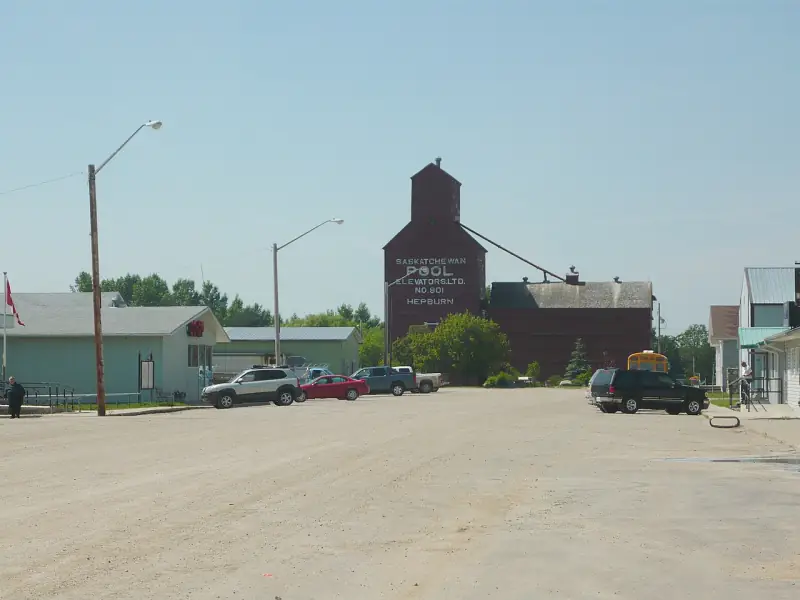 Hepburn's red Saskatchewan Pool grain elevator No. 901 rising behind the village main street
