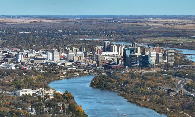 Aerial view of downtown Saskatoon and its bridges along a bend of the South Saskatchewan River