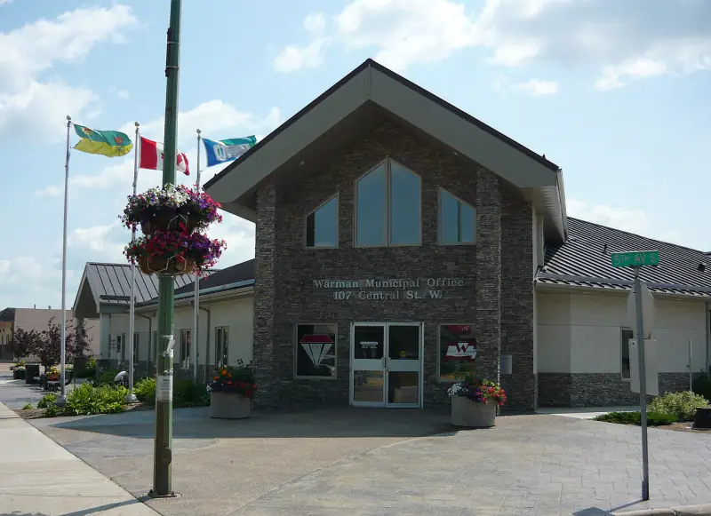 Warman Municipal Office at 107 Central Street West, with flags flying out front