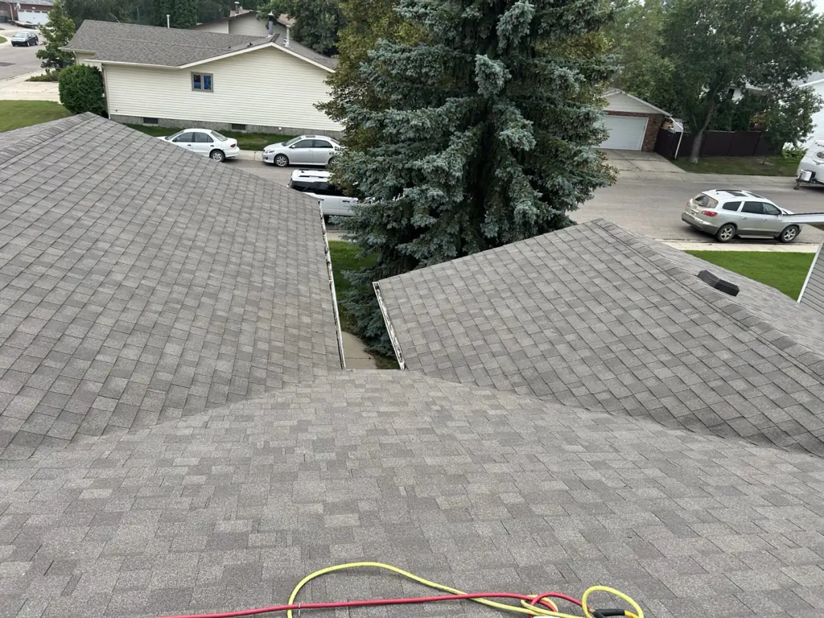 Two newly shingled roof planes and the valley running between them, Saskatoon, SK