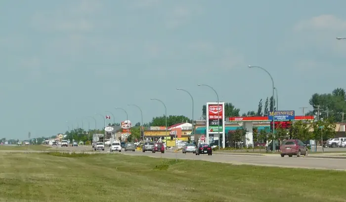 Highway commercial strip in Martensville with the Co-op gas bar and the Martensville community events sign